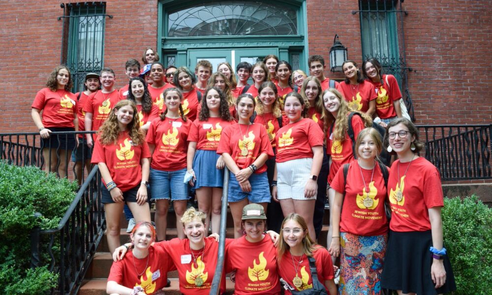 group of teens in red JYCM shirts