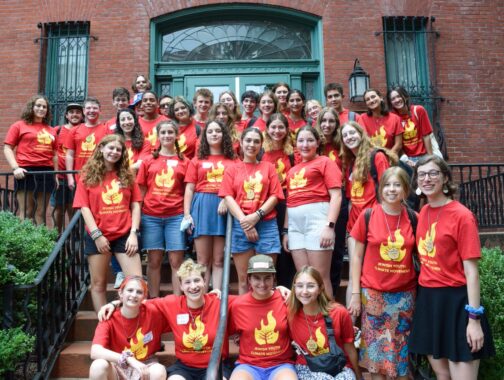 group of teens in red JYCM shirts